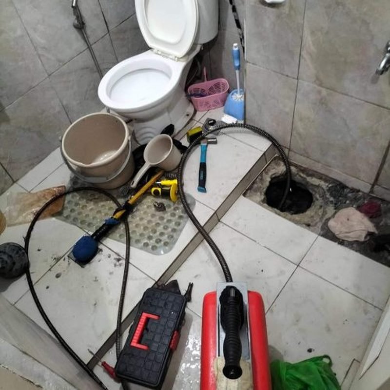 Drain snake equipment set up in a bathroom